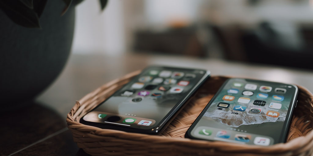 two iphones in a basket