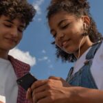 Two teens looking at a phone