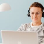 Teen boy working at laptop