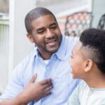 Father and son talking outside