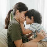 Son and mom sharing a sweet moment on couch together