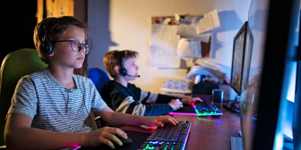 Kids playing Roblox on computers