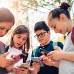 Group of children texting