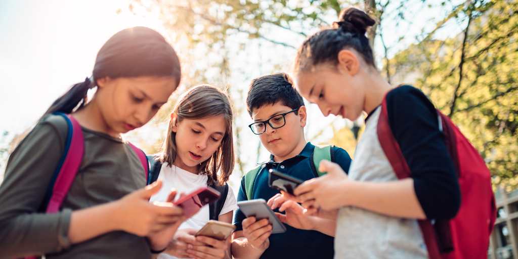 Group of children texting