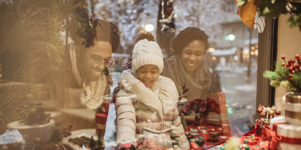 Family looking in shop window