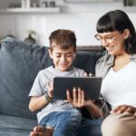 Mother and child looking at tablet together