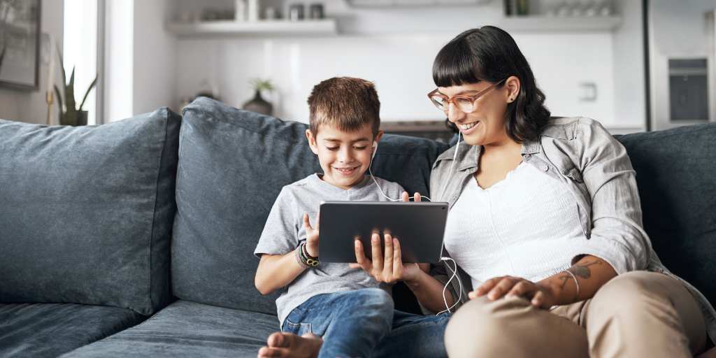 Mother and child looking at tablet together