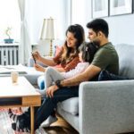 Family taking selfie on couch