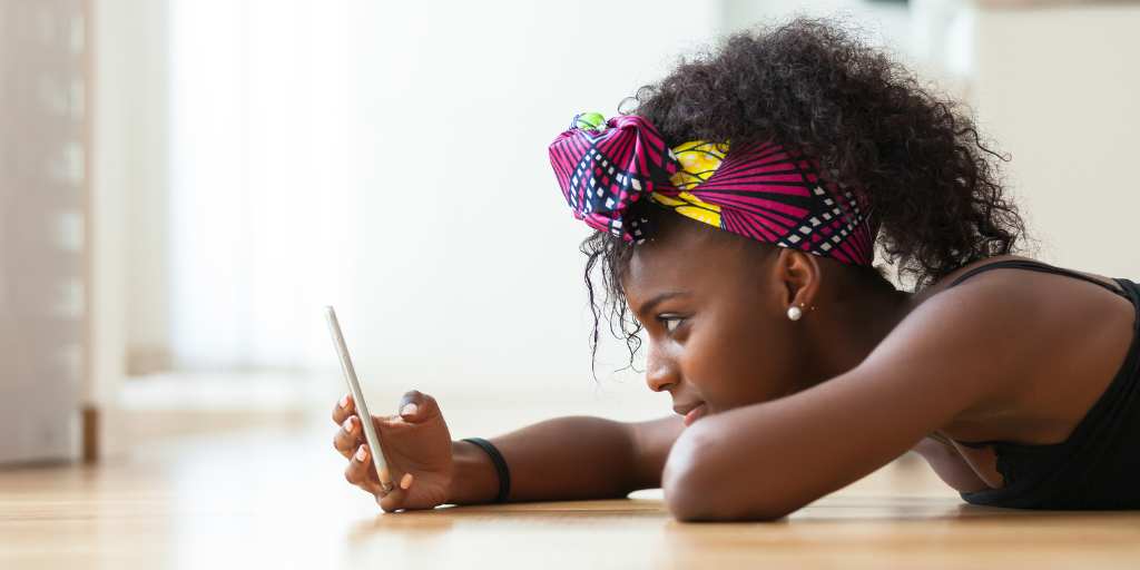 Girl texting on floor