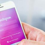 person using Instagram on smartphone