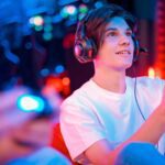 Teen boy playing video game