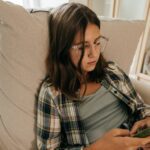 teen girl looking at phone