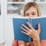 14-year-old girl reading book