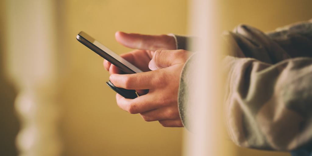 Teen using secret messaging apps on phone