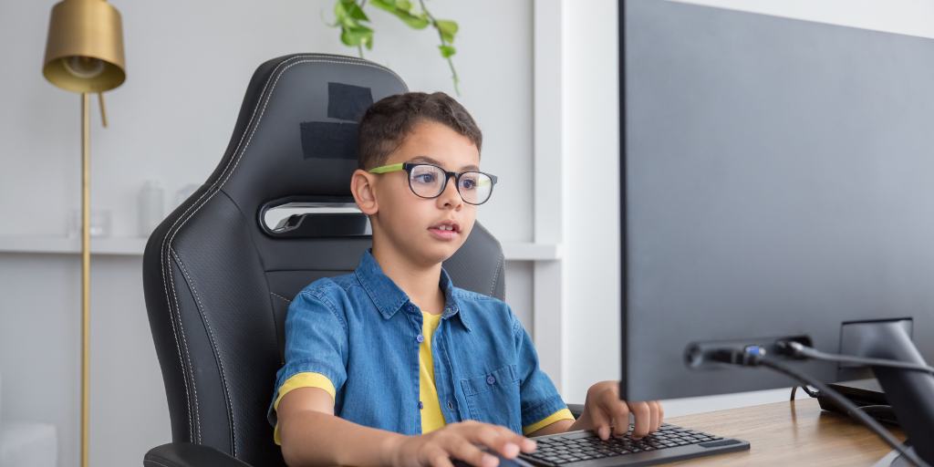 Young boy playing Roblox