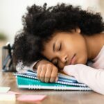 Teen girl sleeping in class