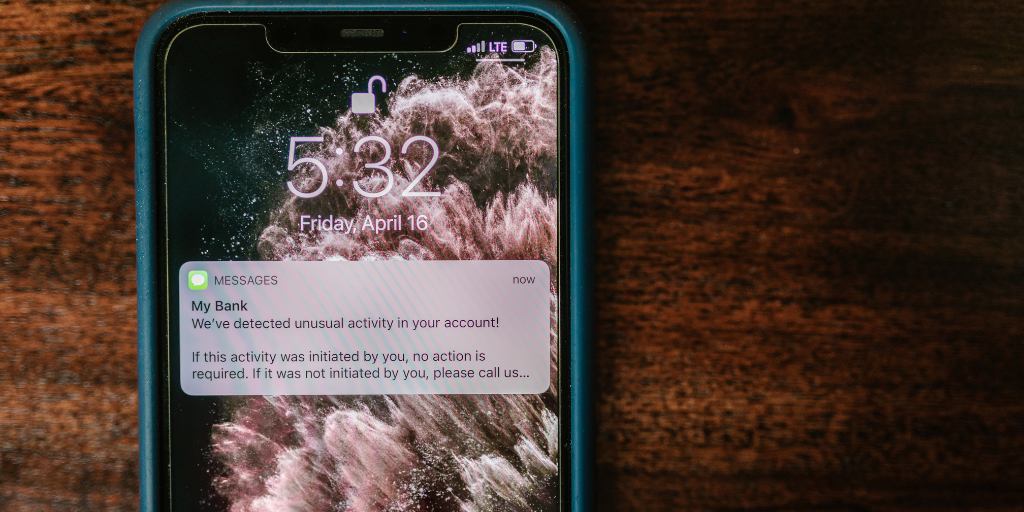 Closeup of iPhone with scam text