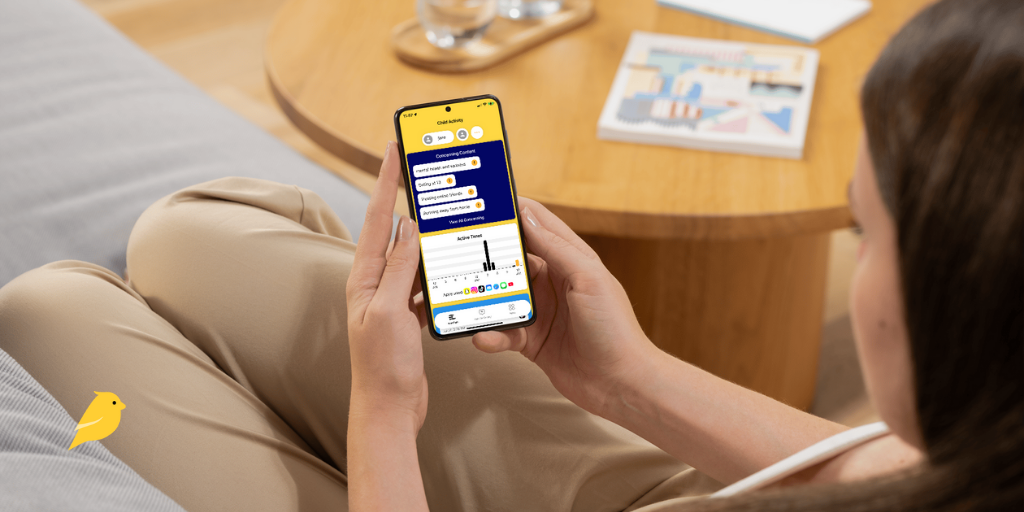 Woman looking at BrightCanary concerning content alerts on iPhone