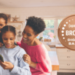 Family next to APA Labs Digital Badge
