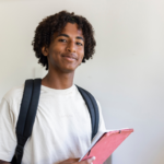 Teen boy wearing backpack