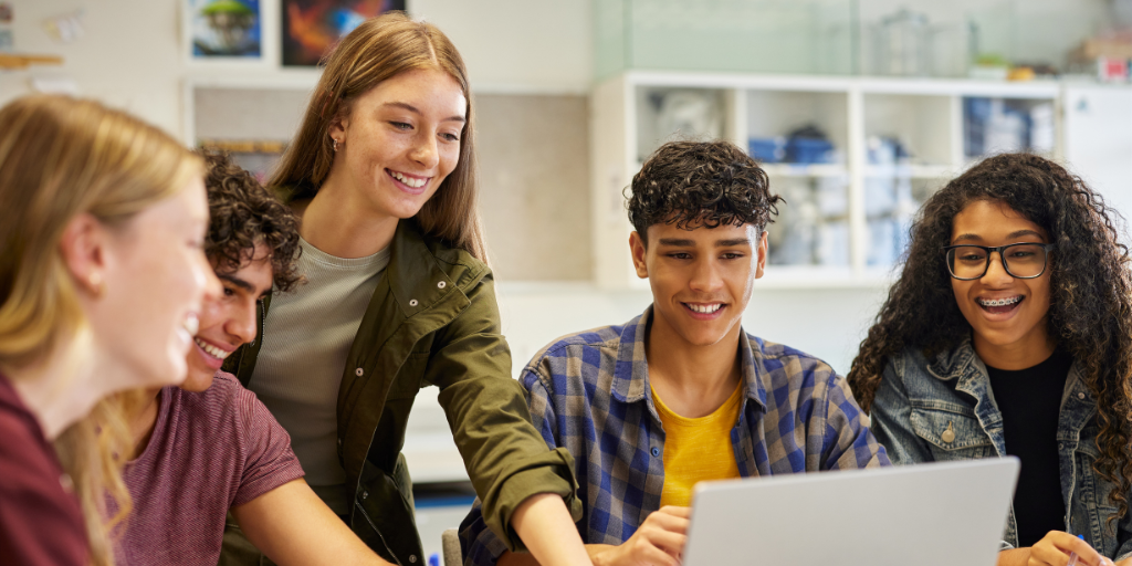 Teens using Ai on laptop in classroom
