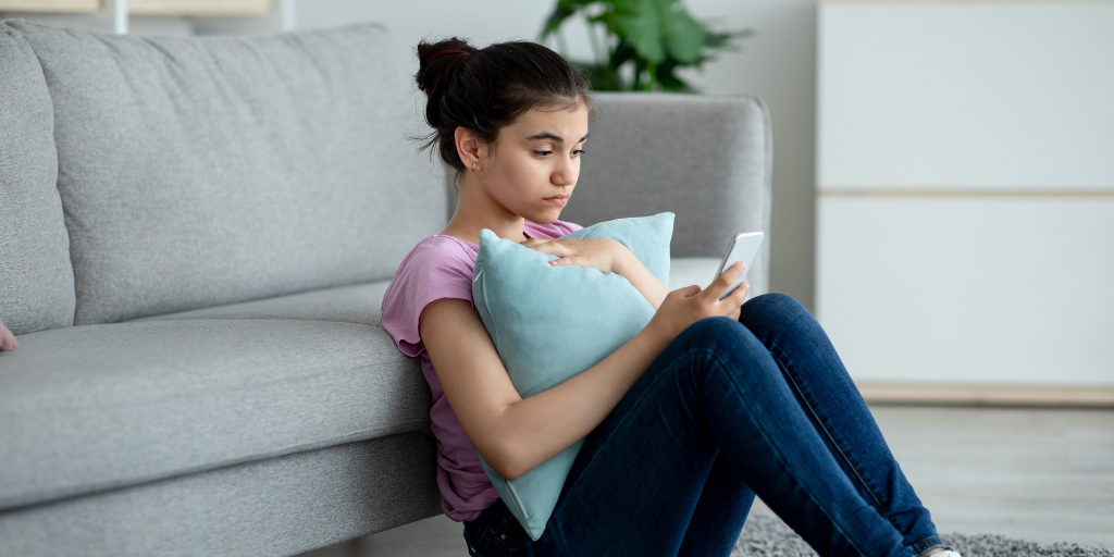 teen using ChatGPT on her phone