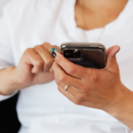 Mom looking at content alerts on phone