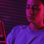 Teen girl looking at smartphone